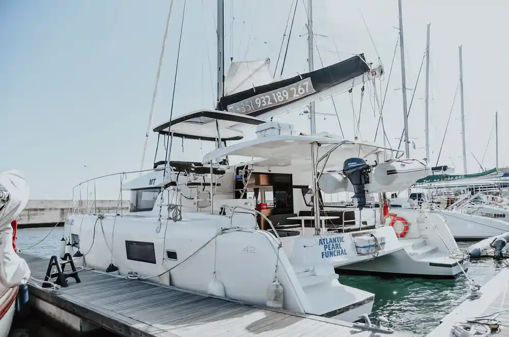 The Atlantic Pearl catamaran moored at the marina pontoon