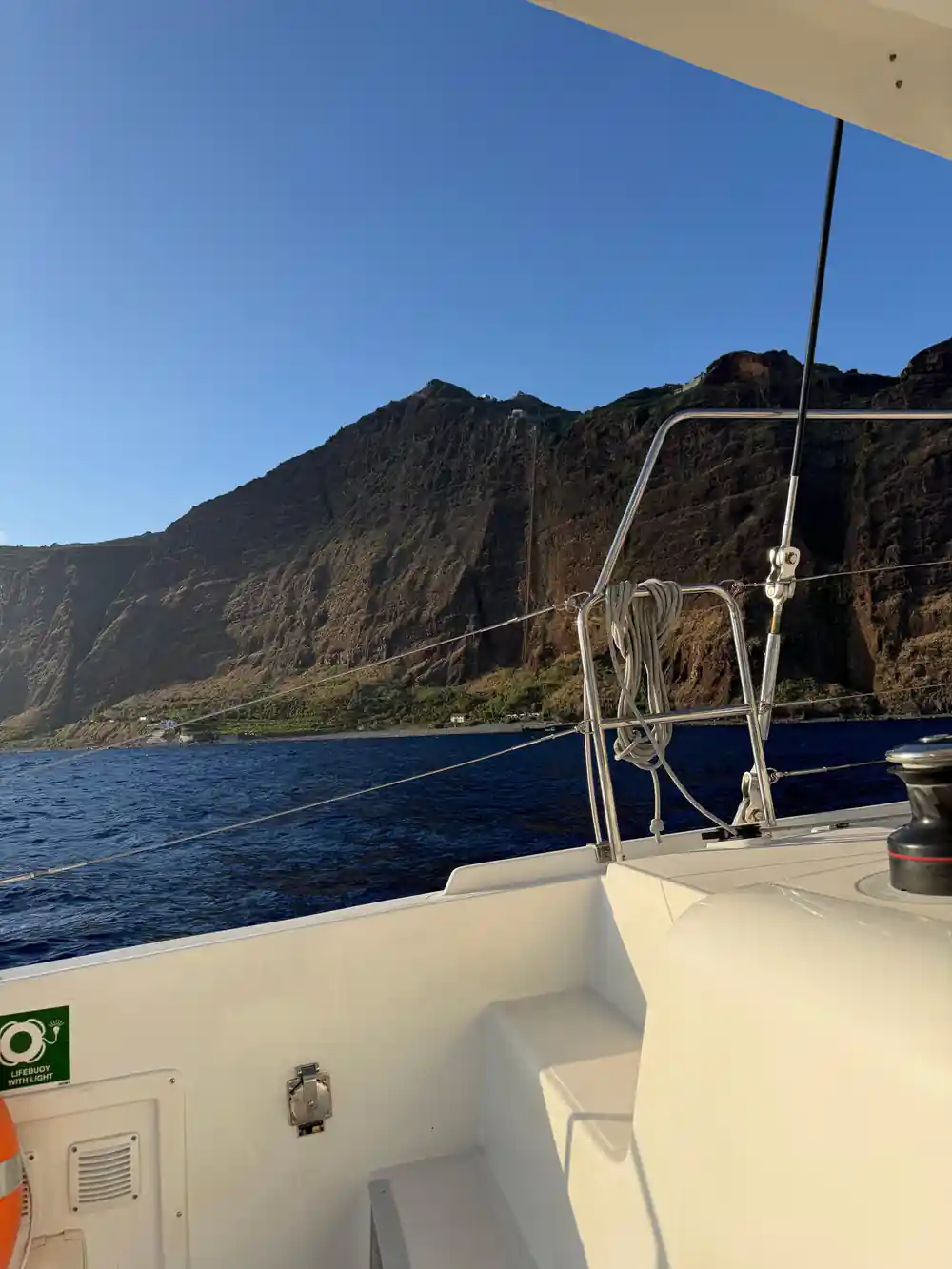 The bow and rigging pointing at a steep headland