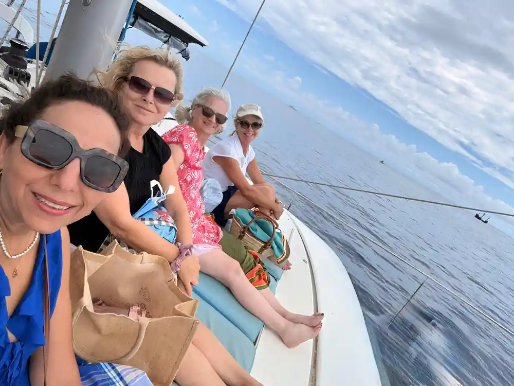 Four guests sitting together along the side deck