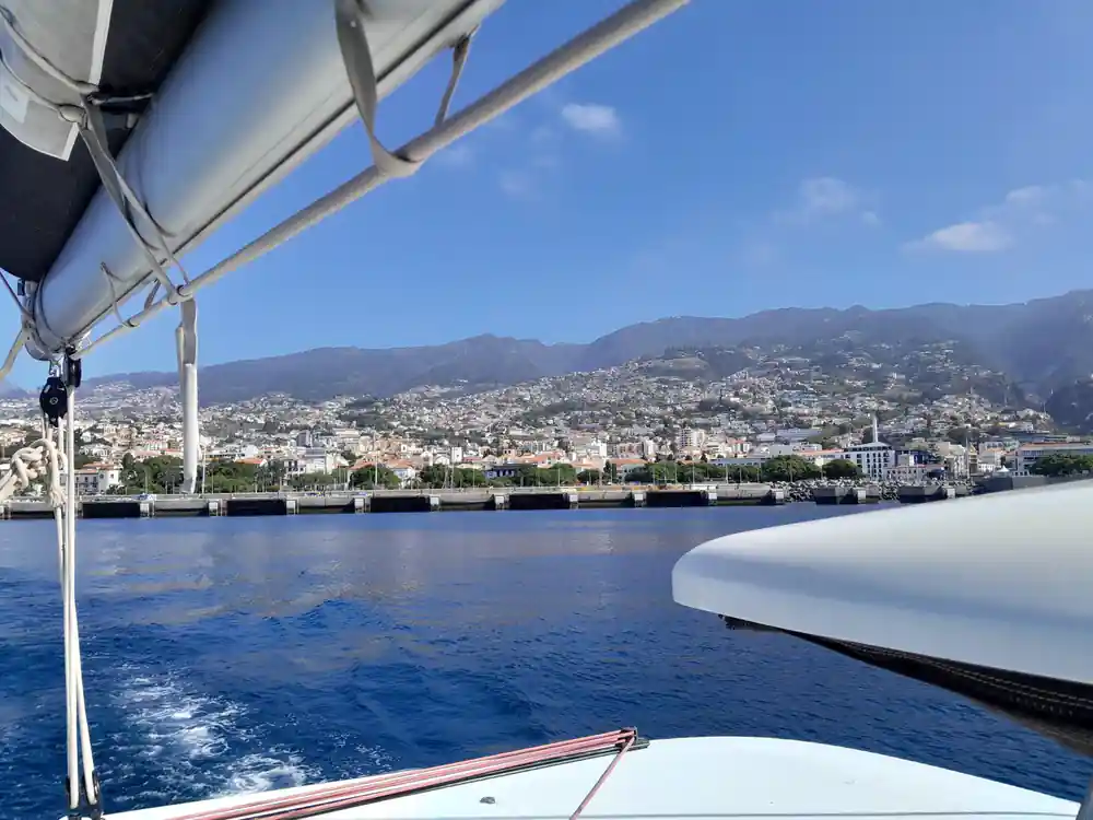 Funchal spread along its hillside seen from the water