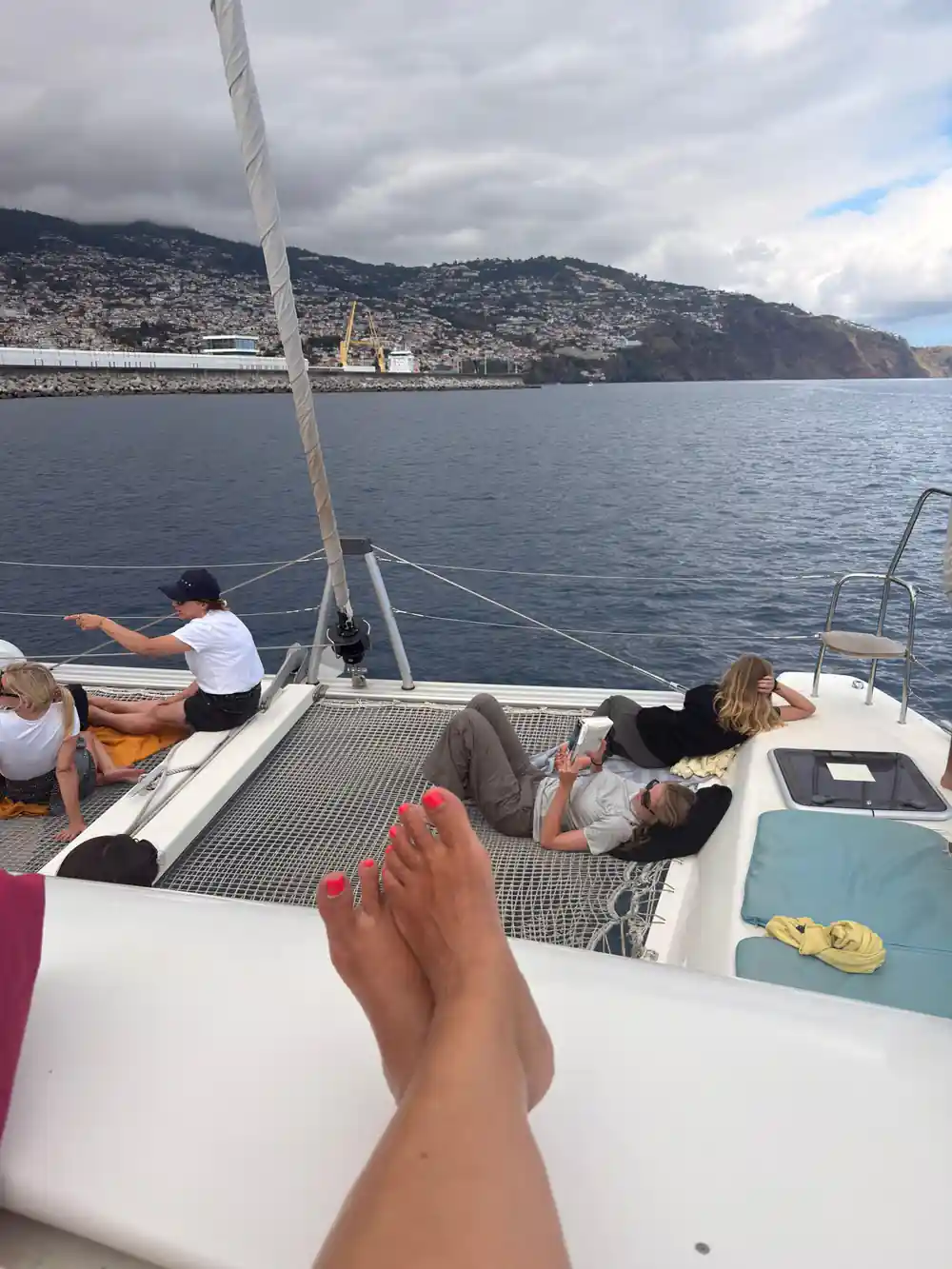 Guests lying out on the trampoline nets in the sun