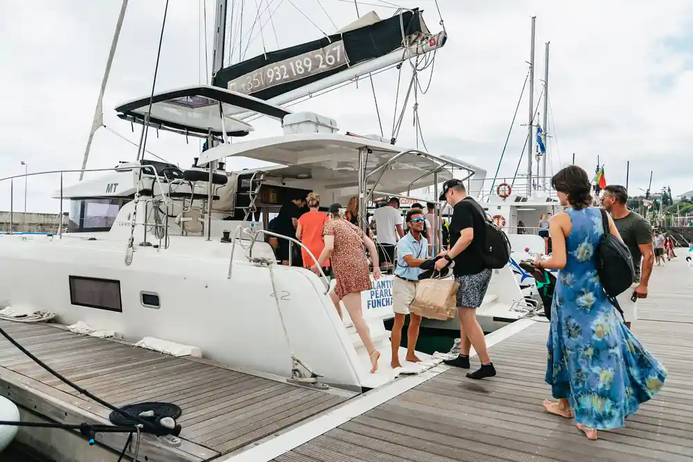 Passengers boarding the catamaran at the marina